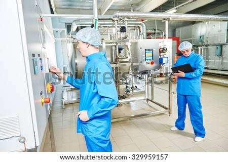 pharmaceutical factory service engineers in water preparation room operating equipment at pharmacy industry manufacture factory
