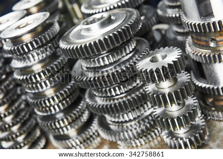 metalwork industry. close-up metal cog wheels gears at factory
