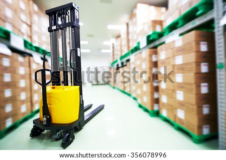 warehouse stacker loader truck at pharmacy factory storehouse