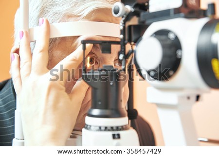 male patient under eye sight examination at ophthalmology clinic