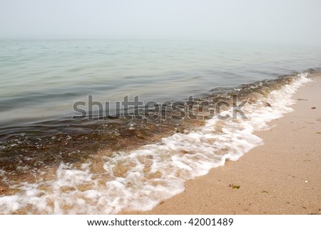 tidal wave and fog on water background of the sea