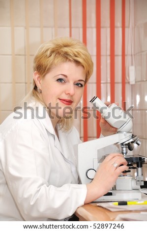 assistance at laboratory work with microscope examining test