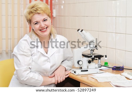 assistance at laboratory work with microscope examining test