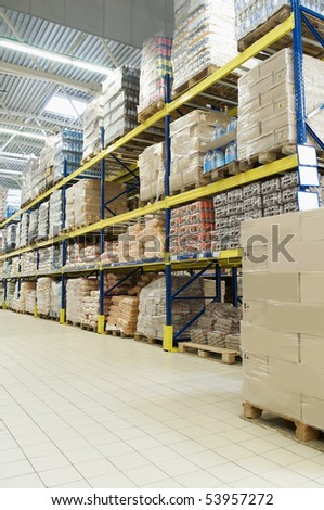 rack stack arrangement of cardboard boxes and goods in a store warehouse