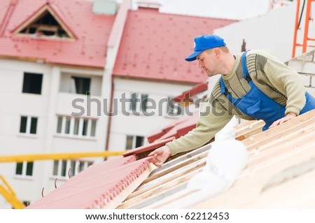 builder worker laborer at roofing tiling works
