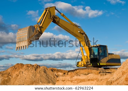 excavator loader machine during earthmoving works outdoors at construction site excavator loader machine during earthmoving works outdoors at construction site