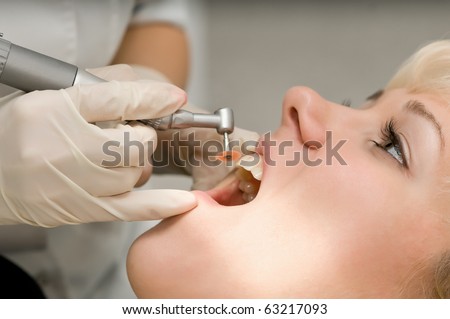 close-up medical dentist procedure of teeth polishing