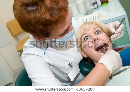 medical dental teeth surgery procedure exodontia at clinic with scared patient