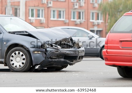 Two car crash accident on a road in city