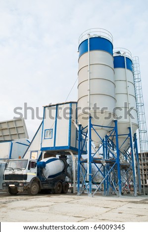 Stationary Concrete Batching Plant unloading cement into mixer truck