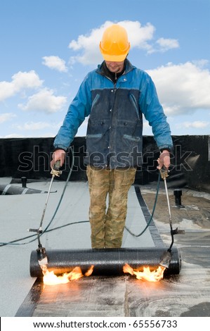 http://image.shutterstock.com/display_pic_with_logo/390130/390130,1290344994,1/stock-photo-roofing-felt-installation-with-heating-and-melting-roll-of-bitumen-roll-by-torch-on-flame-65556733.jpg
