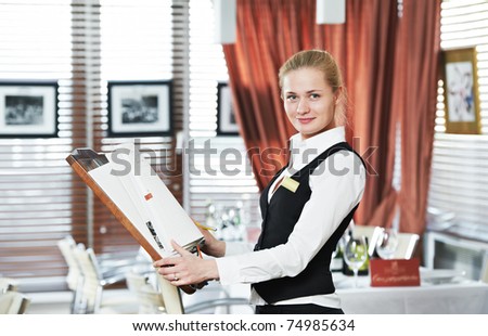 Happy beautiful restaurant manager woman administrator at work place