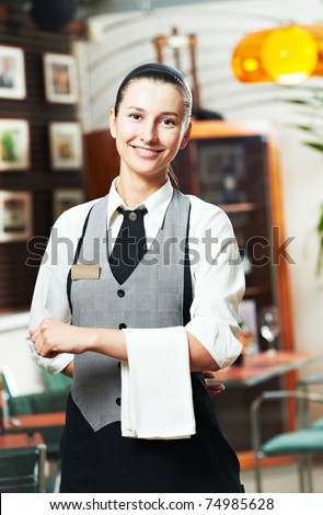 Waitress girl of commercial restaurant in uniform waiting an order