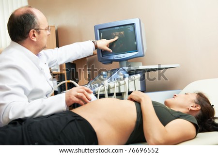 Doctor with ultrasonic equipment during ultrasound medical examination