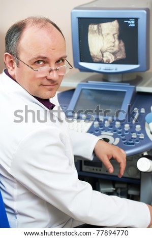 Male doctor with ultrasonic equipment during ultrasound medical examination