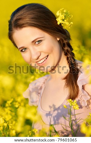 stock photo beautiful smiling young girl at yellow green rape meadow