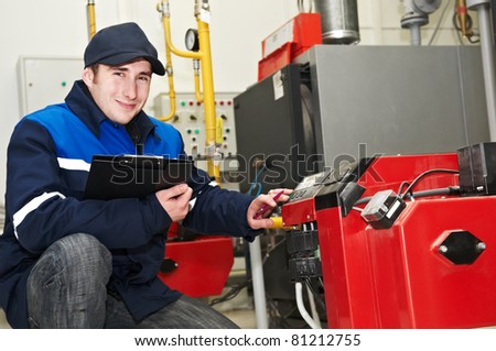 maintenance repairman engineer of heating system equipment in a boiler house