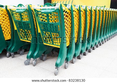 Plastic shopping carts stayed in row at shopping shop