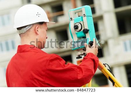 One surveyor worker with theodolite equipment outdoors input the data