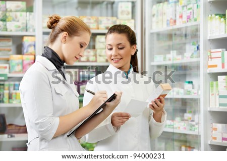 two pharmacist chemist women working in pharmacy drugstore two pharmacist chemist women working in pharmacy drugstore