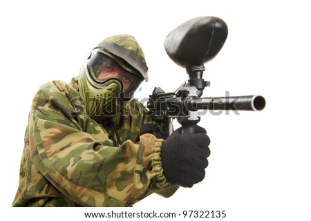 Aiming paintball sport player man in protective camouflage uniform and mask with marker gun over white background