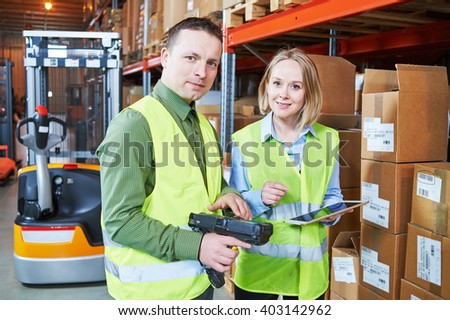 Warehouse Management System. Worker with barcode scanner