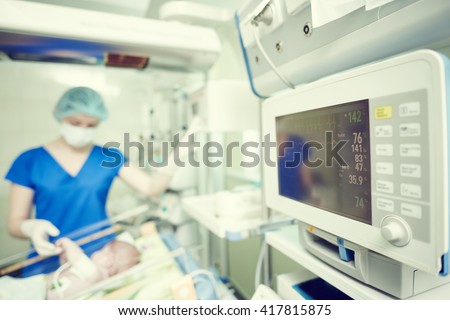 intensive care unit female doctor with baby infant