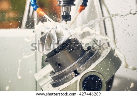 Milling metalworking process. Industrial CNC metal machining by vertical mill