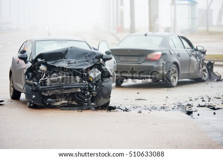 Car crash accident on street with wreck and damaged automobiles after collision