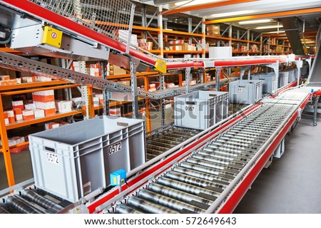 warehouse management system. Conveyer with automaticaly moving boxes