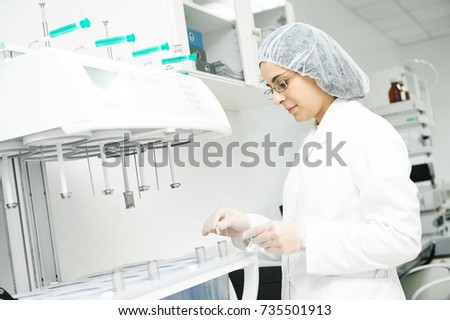 Pharmaceutical researcher making dissolution test