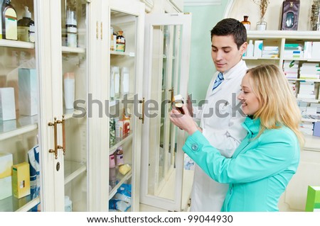 pharmacist assistance of buying medical drug to buyer in pharmacy drugstore