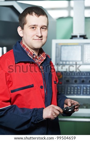 mechanical technician worker after measuring detail tool before processing on cutting machine center at workshop