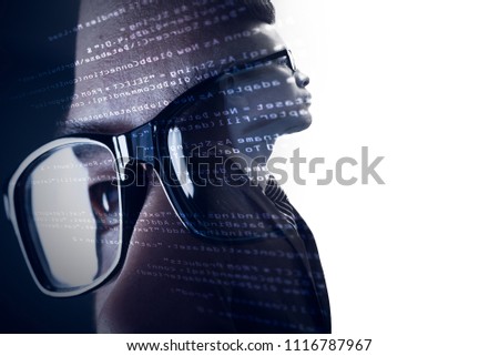 The double exposure image of the businessman standing overlay with source code and programmer image and copy space. The concept of programming, cyber security, business and internet of things.