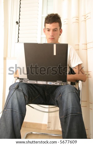 boy working in portable pc