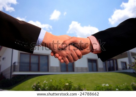 business shake hand (house contract)