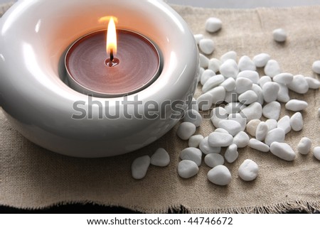 candles and massage stones in a calm zen spas