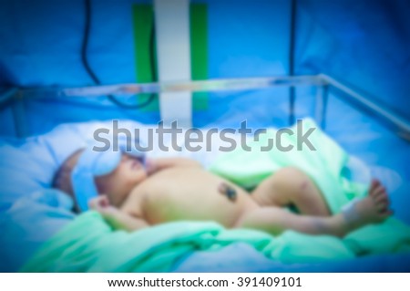 soft focus blur background newborn is doing on phototherapy because neonatal jaundice disease