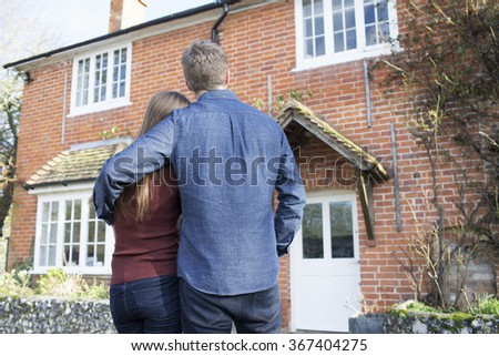 Couple looking at their home