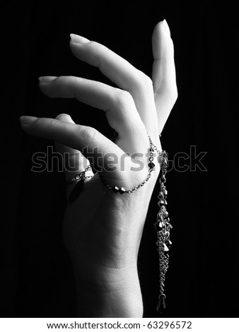 mystic black & white female hand with gothic chain