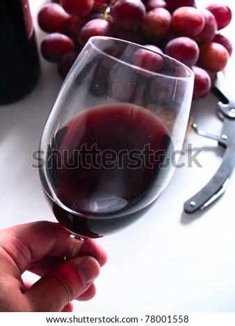 tasting chianti italian reserve wine, with grapes, corkscrew and bottle background