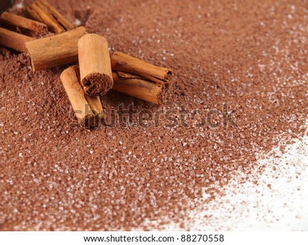 cinnamon sticks over cocoa powder