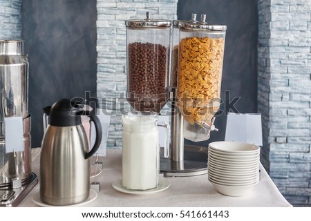Dispenser Breakfast buffet with chocolate balls and corn flakes