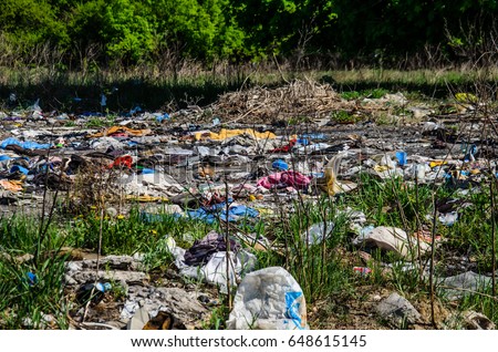 Piles of the different garbage on a ground