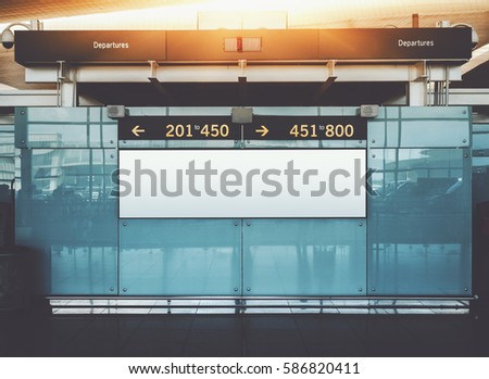Blank electronic departures and arrival informational billboard with clean space for publicity content or text message, narrow advertising mock up in interior, public commercial board in airport hall