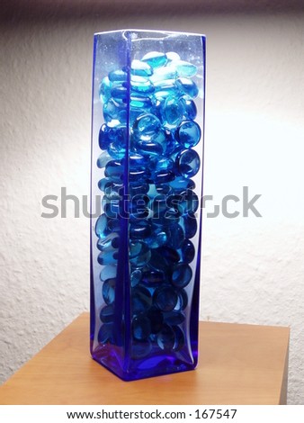 Glass with transparent blue stones