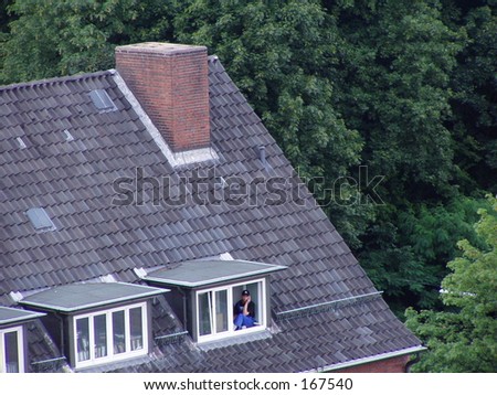 Calling man on a roof