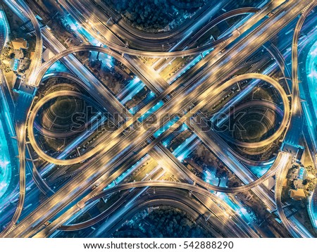 Road beautiful Aerial View of Busy Intersection at Night , top view , thailand .