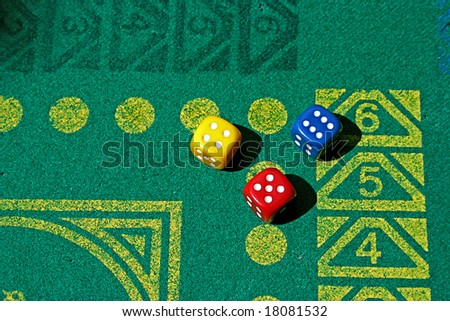 tree dice with number four, five and six in green game table