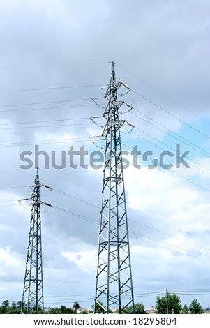 electric power station in the field in blue cloudy sky